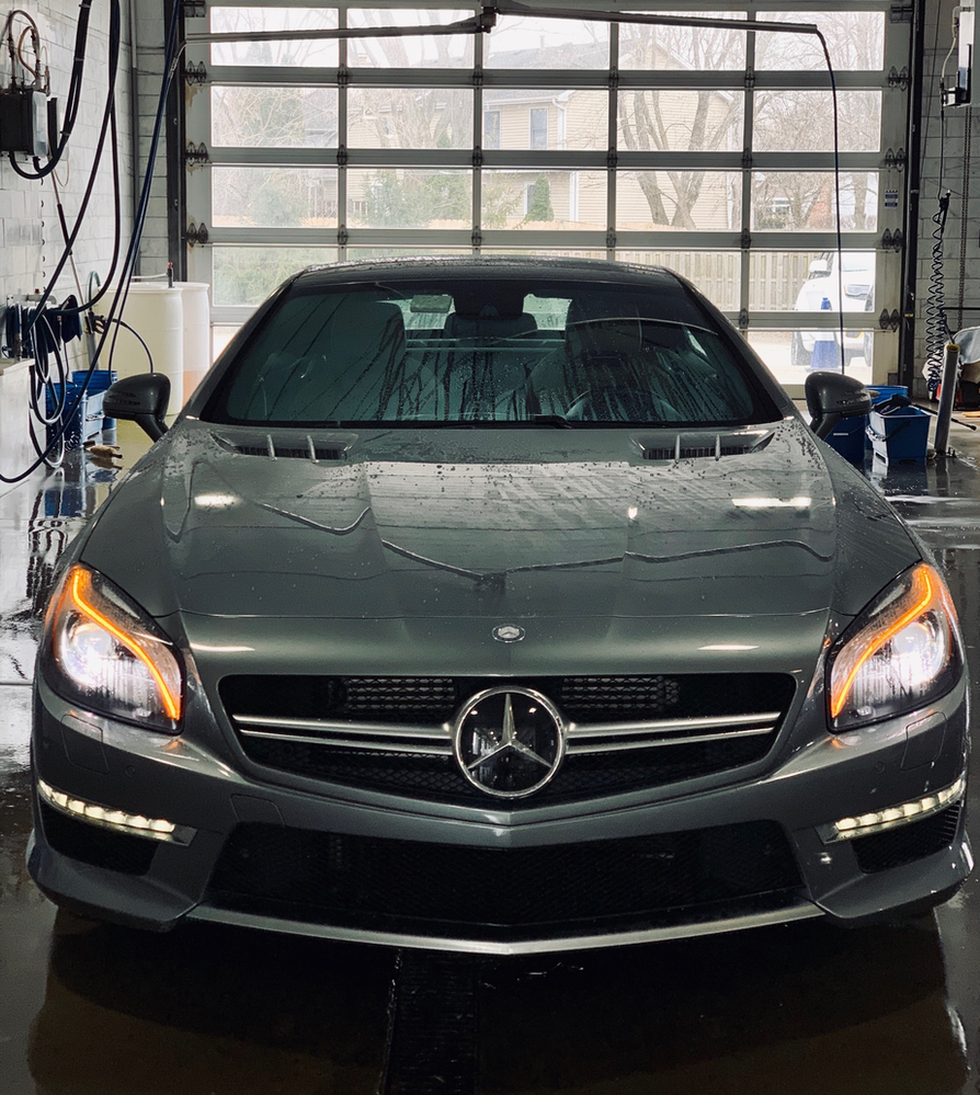 A mercedes benz sl63 is parked in a garage
