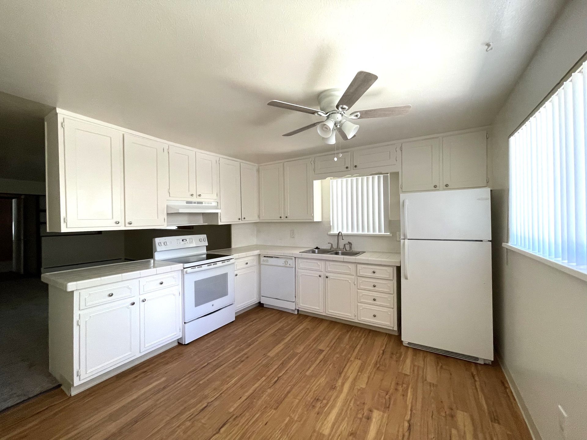 A photo showing a medium-size kitchen with plenty of natural light