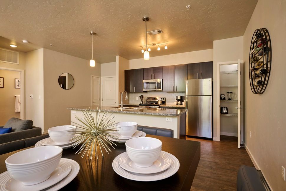 Dining room with table set for four — Parkcenter Apartments