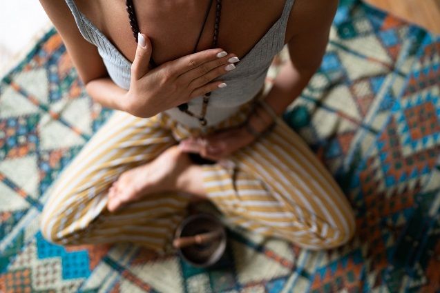 Woman in yoga pose — The District at Parkcenter