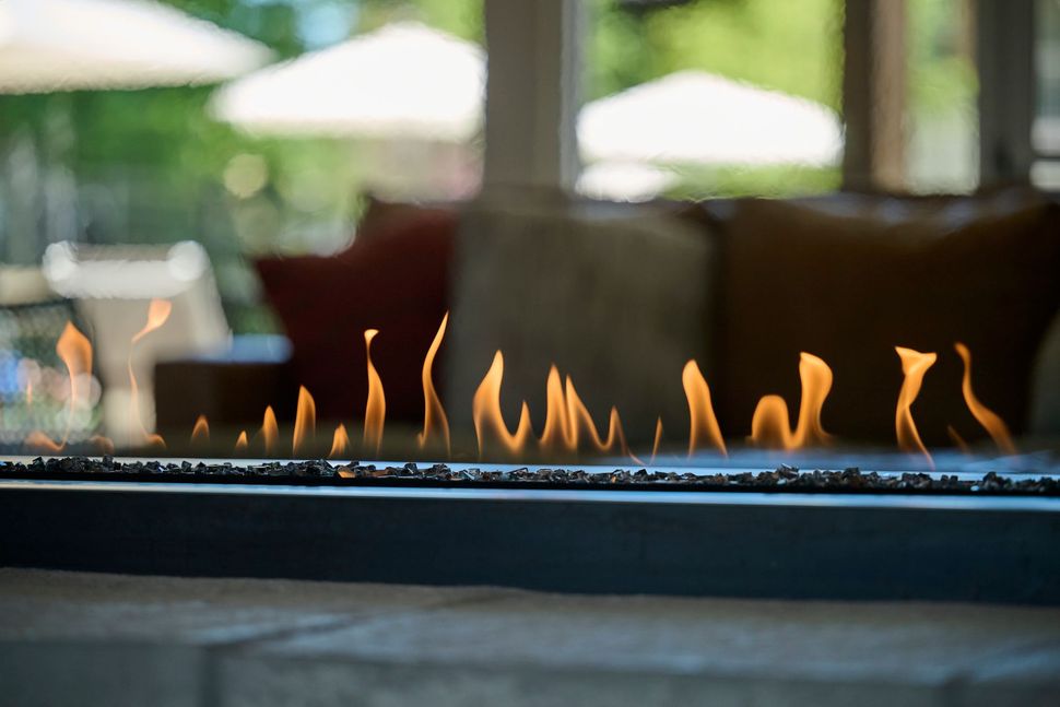 Flames from a fireplace — The District at Parkcenter