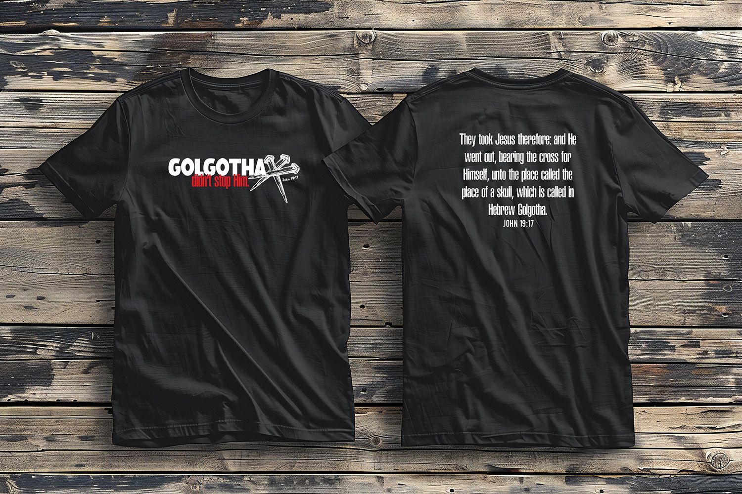 Two black t-shirts displayed on wood: one shows 