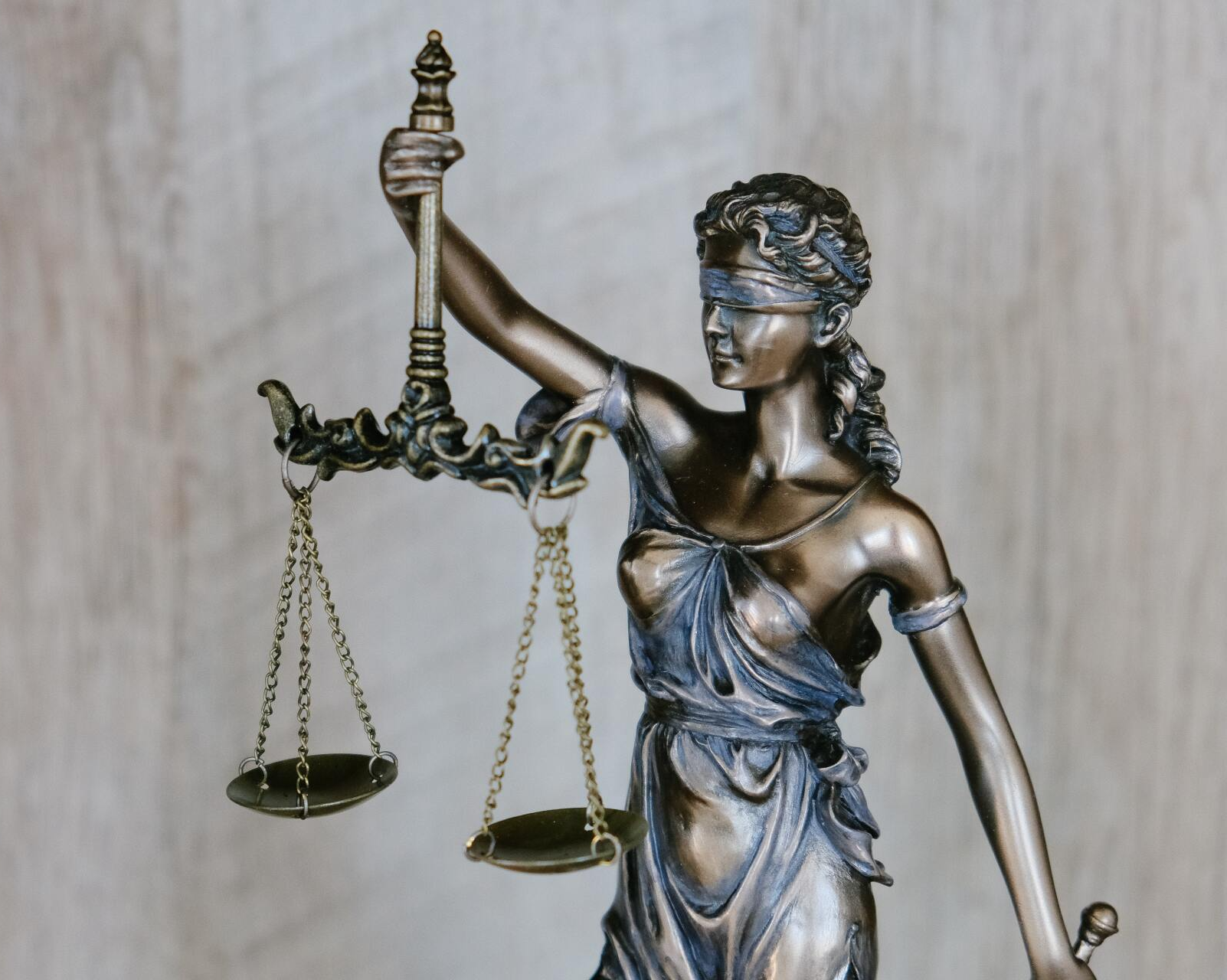 Nick Shigeoka - Family Law A statue of blindfolded lady justice holding scales of justice