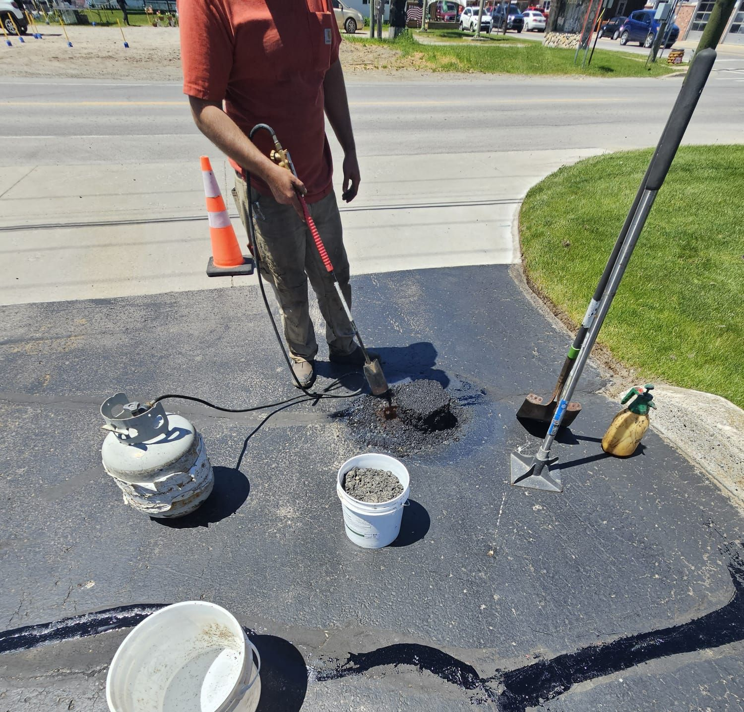 alpena asphalt armor llc fixing potholes at orsa credit union in atlanta michigan