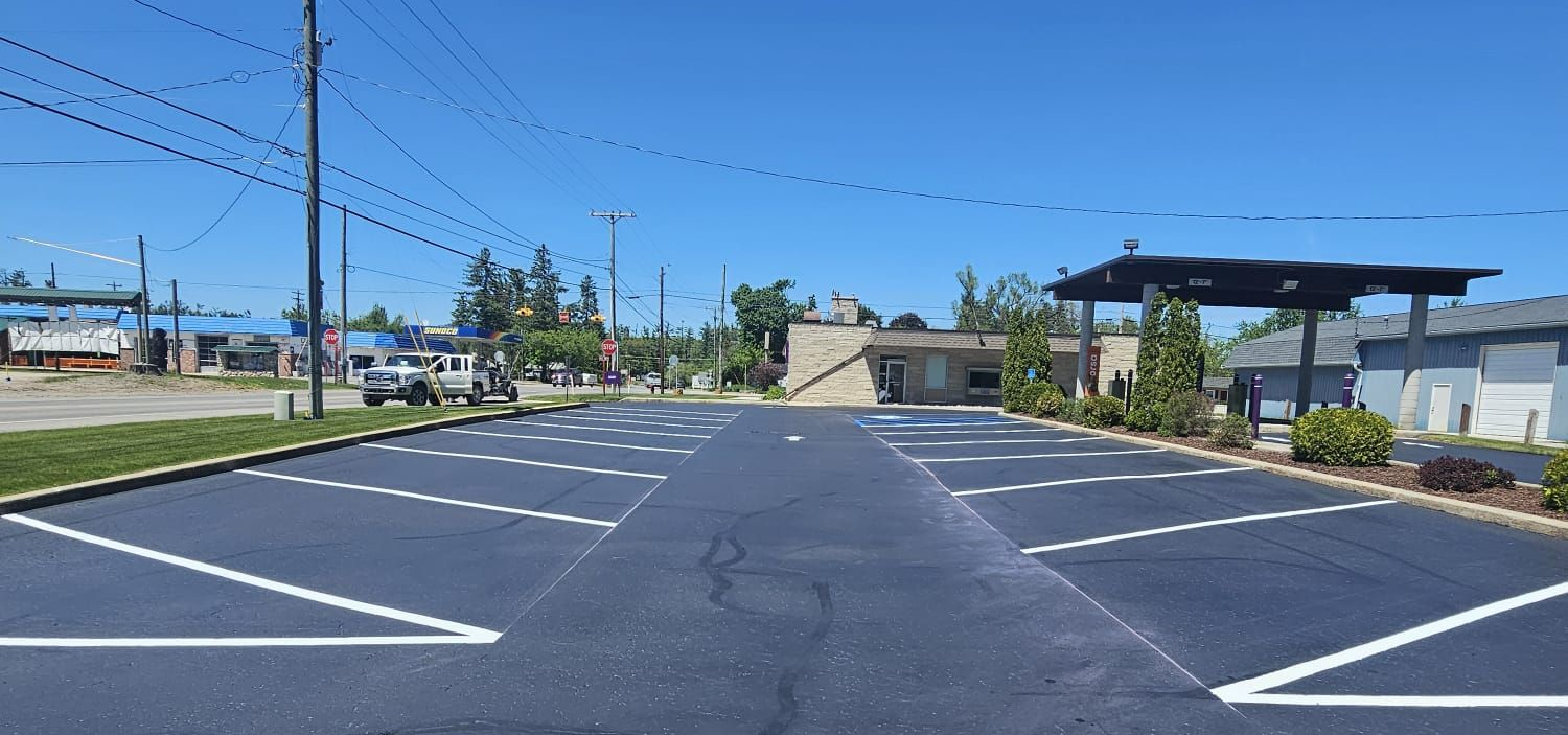 orsa credit union in atlanta michigan with new parking lot lines striped by alpena asphalt armor llc.