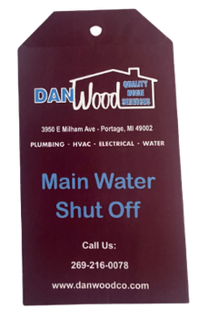 A tag that says main water shut off on it