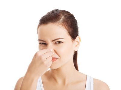 Woman Covering Her Nose — Portage, MI — Dan Wood Company