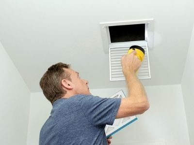 Checking Air Duct — Portage, MI — Dan Wood Company Checking Air Duct — Portage, MI — Dan Wood Company