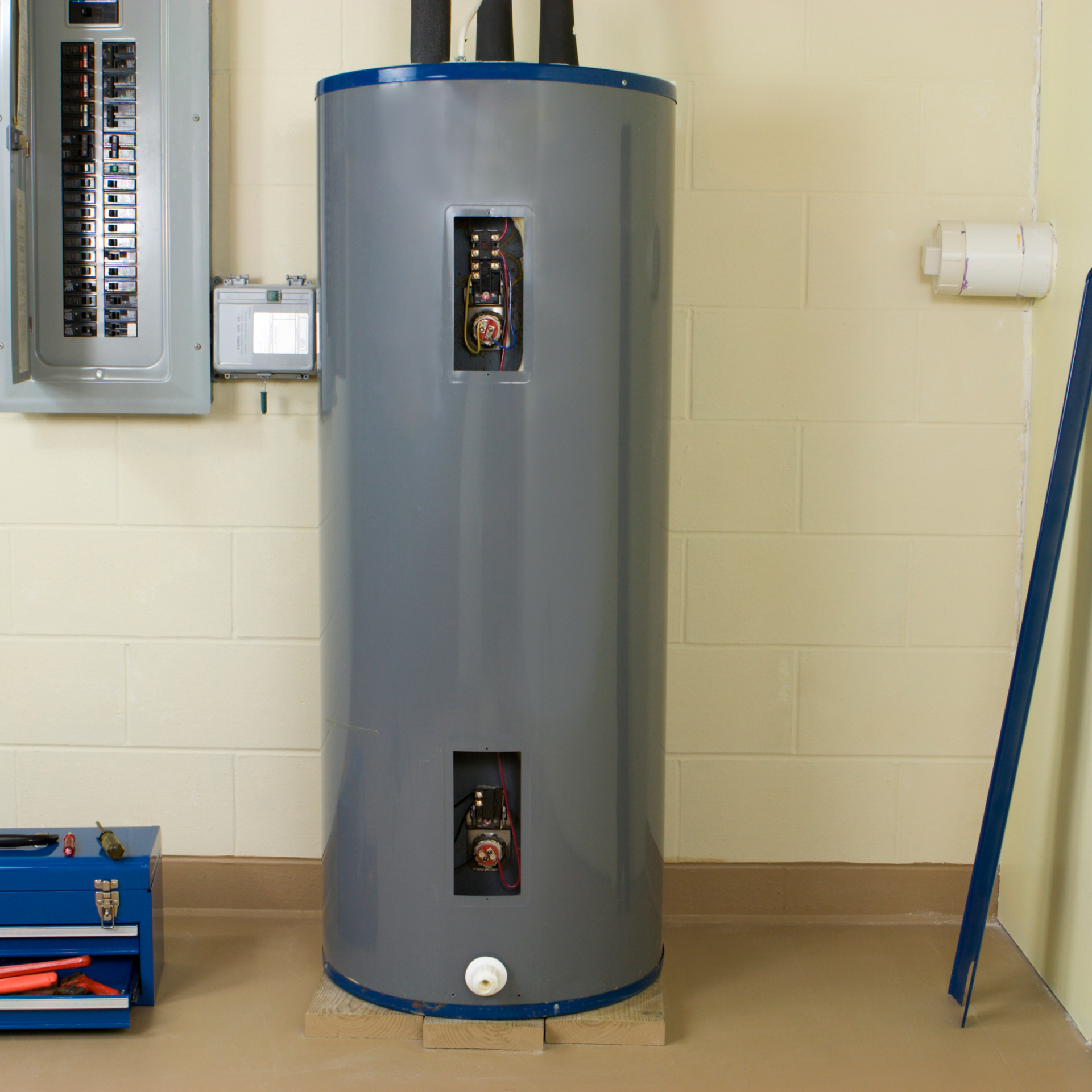Plumber inspecting a water heater