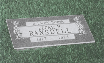 Gravestone on grass reading “A loving father, Edgar H. Ransell, 1917–1974”