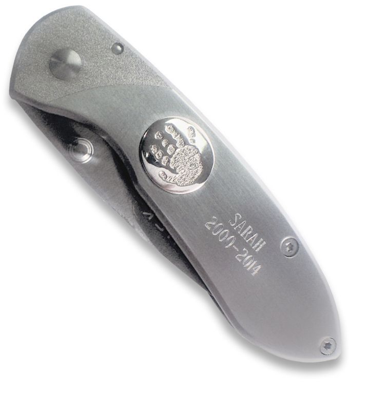 Silver folding knife on a white background