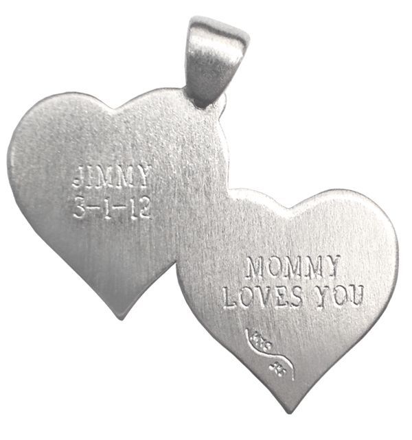 Two silver heart pendants, one engraved “JIMMY 3-1-12” and one “MOMMY LOVES you”