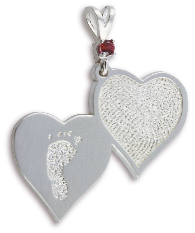Two silver heart-shaped pendants, one with a textured footprint and one with a red gem connector.
