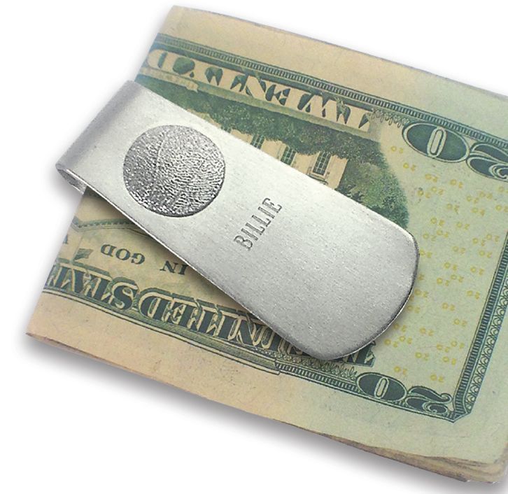 Silver BILLY money clip holding a folded U.S. dollar bill
