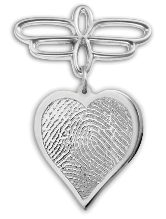 Silver dragonfly and heart-shaped pendant with textured surface