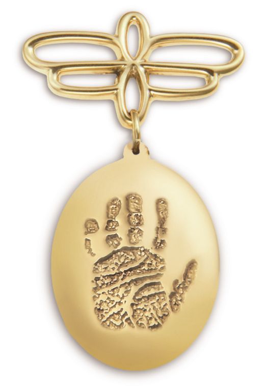 Gold pendant with a raised handprint charm on a decorative looped top