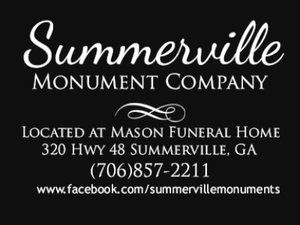 Somerville Monument Company sign with contact info at Mason Funeral Home in Somerville, GA.