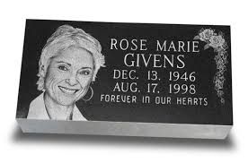 Memorial plaque with a smiling portrait and the name Rose Marie Givens, dates 1946–1998, “Forever in our hearts.”