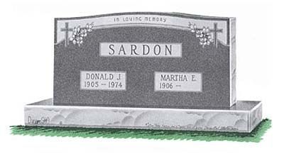 Gray memorial headstone with cross, engraved “SARDON,” on a base with two name plaques.