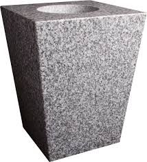 Gray granite trash bin with a square body and round opening on top