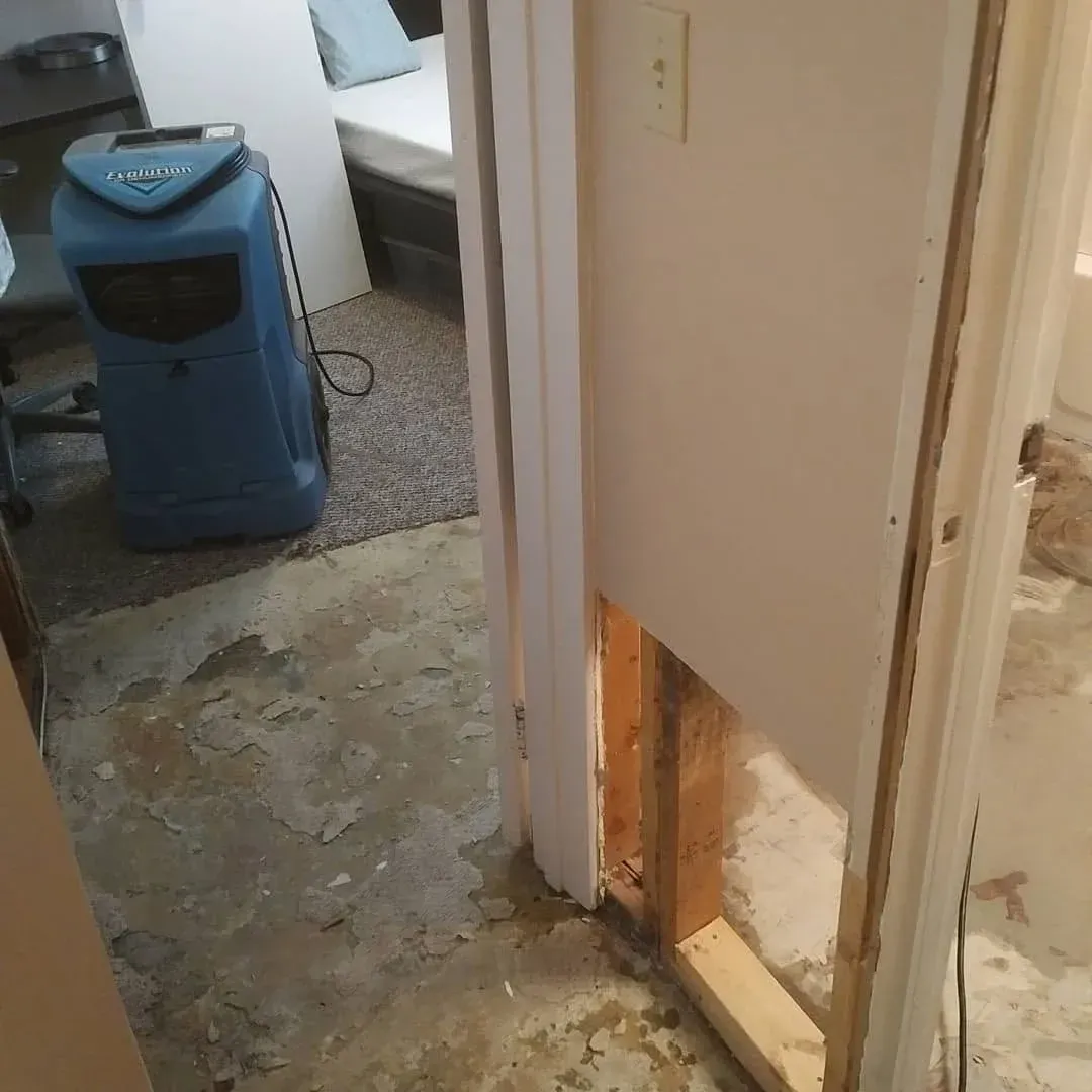 Water-damaged flooring and drywall being dried with commercial restoration equipment in a Saskatoon home Water-damaged flooring and drywall being dried with commercial restoration equipment in a Saskatoon home