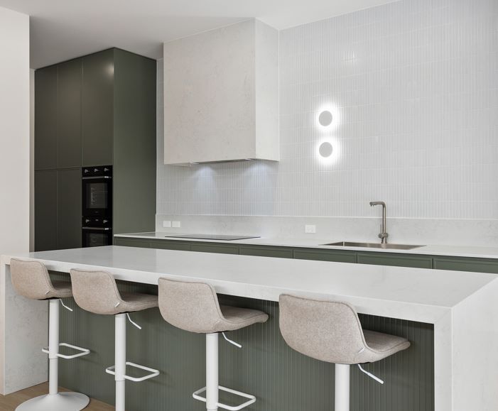 A Kitchen With a Long Counter Top and Stools — Darko's Kitchens in Fairy Meadow, NSW