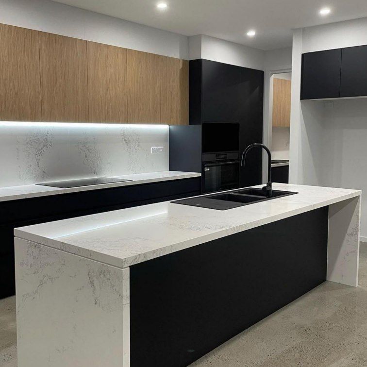 A Kitchen With a Large Island and a Sink — Darko's Kitchens in Kiama, NSW