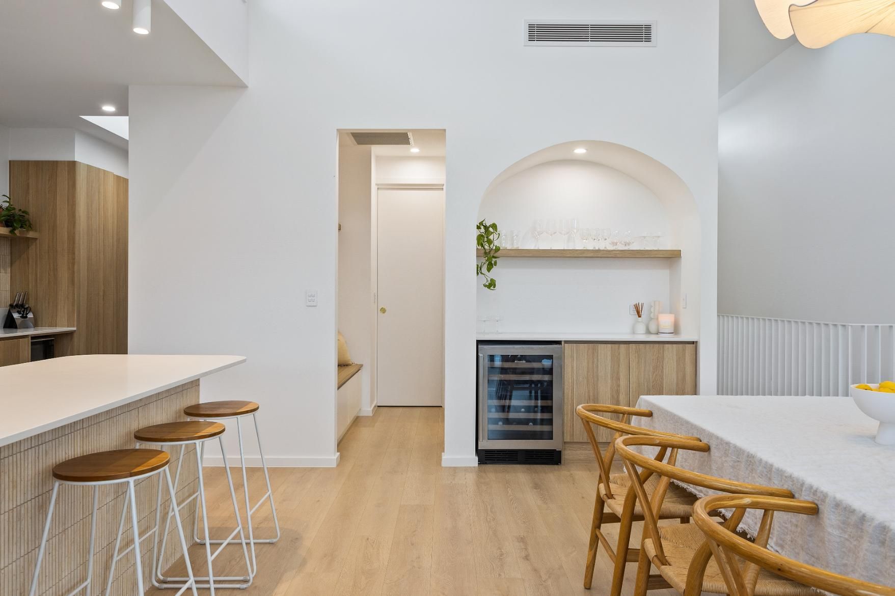 A Kitchen with A Table and Chairs and A Refrigerator — Darko's Kitchens in Calderwood, NSW