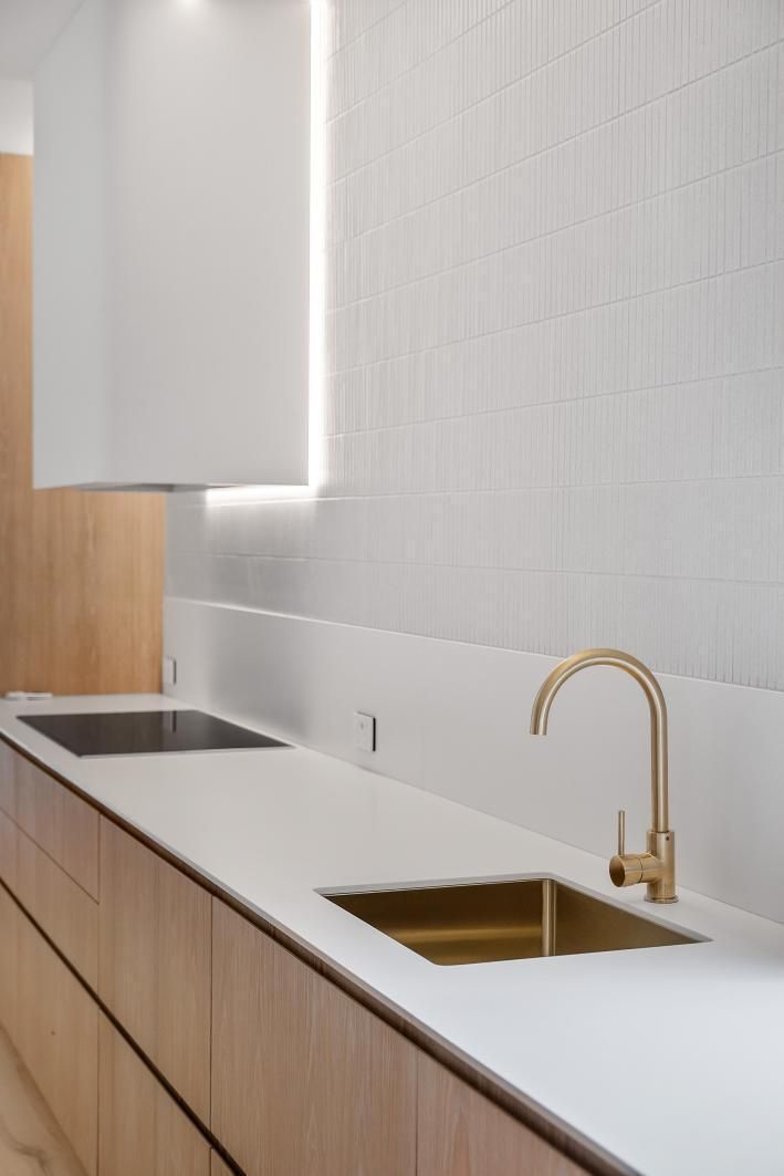 A Kitchen With a Sink and a Brass Faucet — Darko's Kitchens in Woonona, NSW