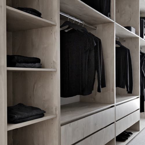 A Walk in Closet Filled With Black Clothes and Shoes — Darko's Kitchens in Albion Park Rail, NSW