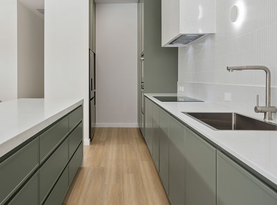 A Kitchen With a Sink , Stove and Refrigerator — Darko's Kitchens in Albion Park Rail, NSW