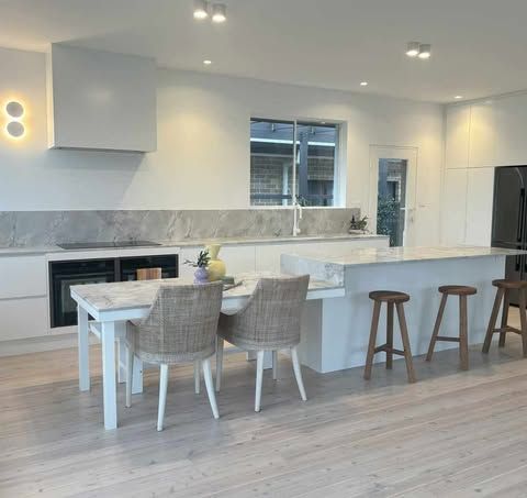 A Kitchen With a Table and Chairs and Stools — Darko's Kitchens in Southern Highlands, NSW
