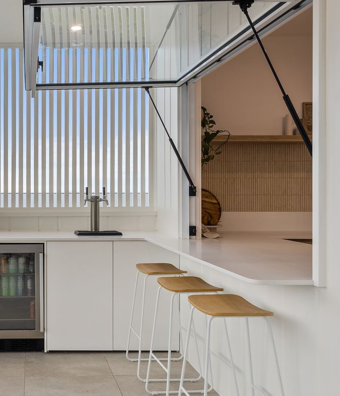 A Kitchen With Stools and a Window That is Open — Darko's Kitchens in Unanderra, NSW