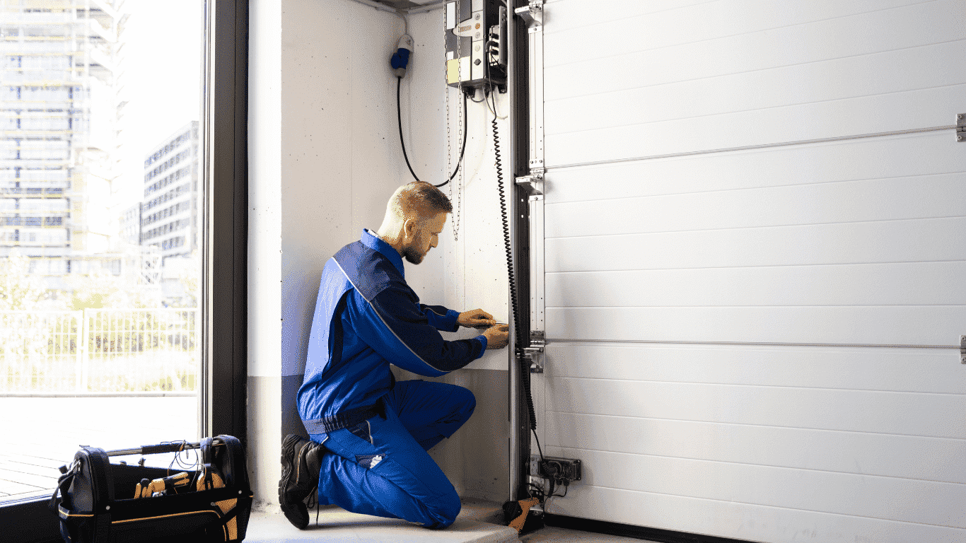 handyman working on installing garage doors