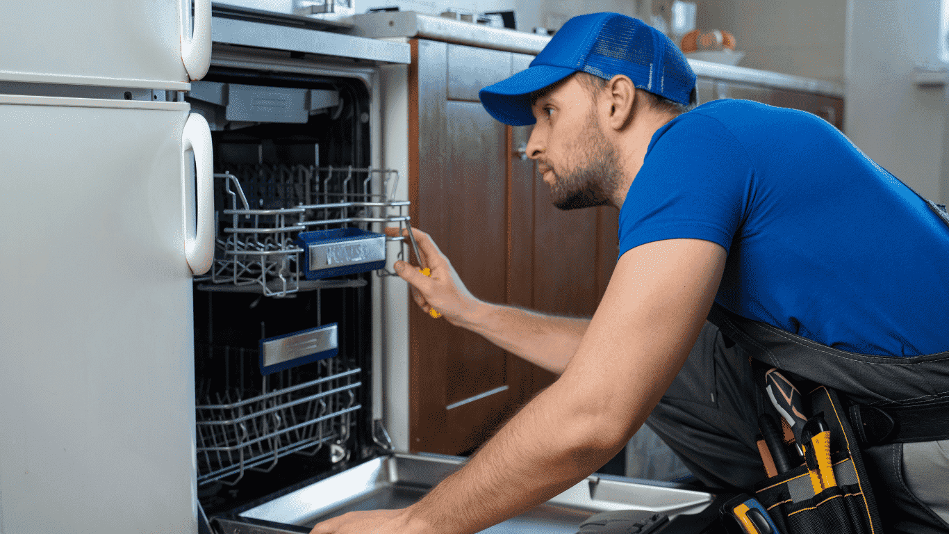 technician inspecting washing machine