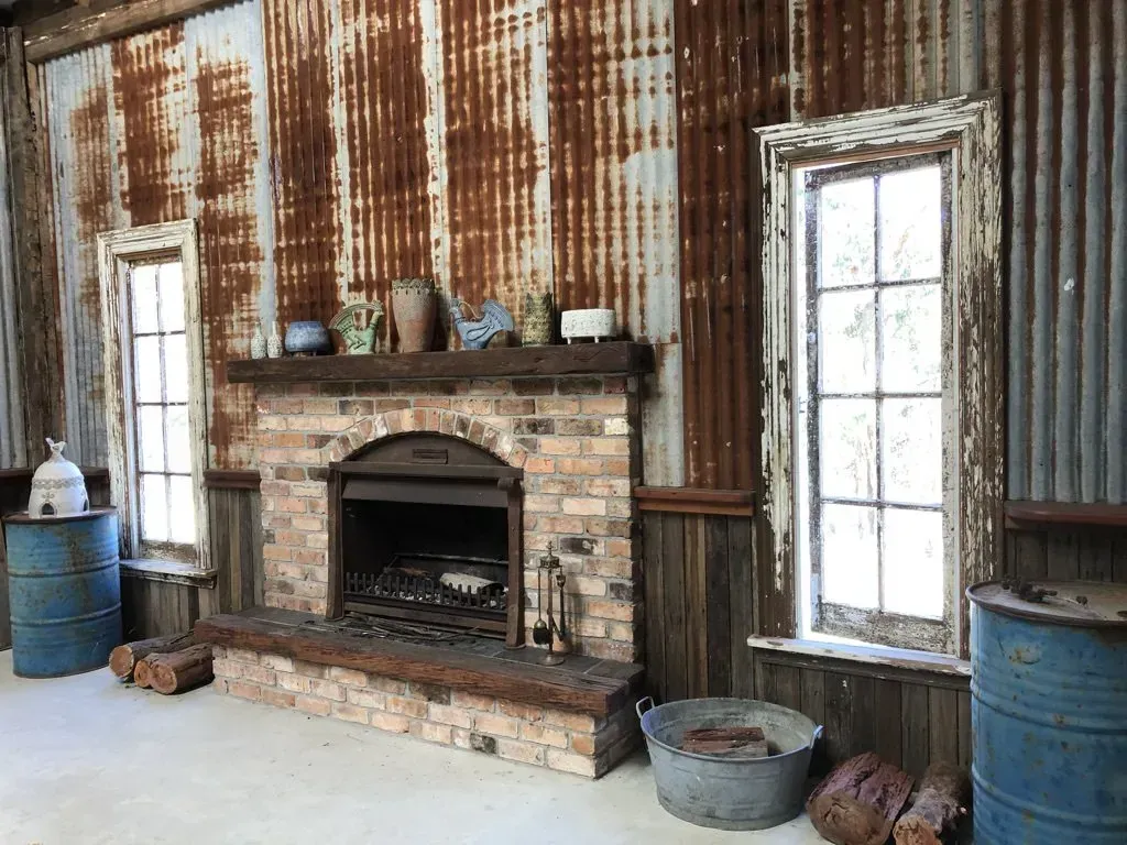 Rustic Room with Corrugated Metal Walls, Brick Fireplace — Boyne Building & Renovations in Ponto, NSW