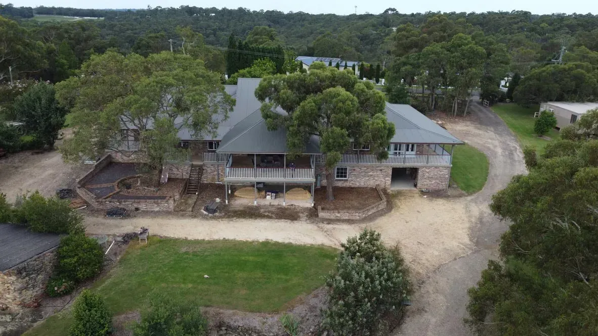 Aerial View of A Long House with A Dark Roof — Boyne Building & Renovations in Ponto, NSW