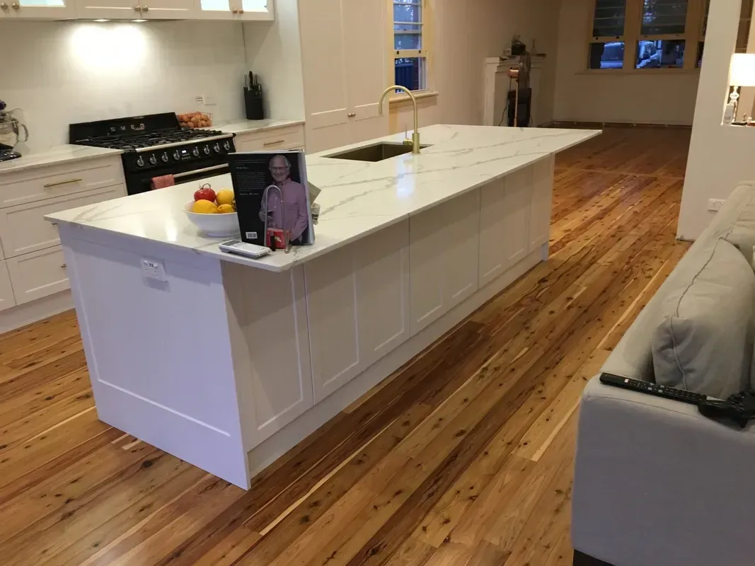 Modern Kitchen with White Island, Wood Floors — Boyne Building & Renovations in Ponto, NSW