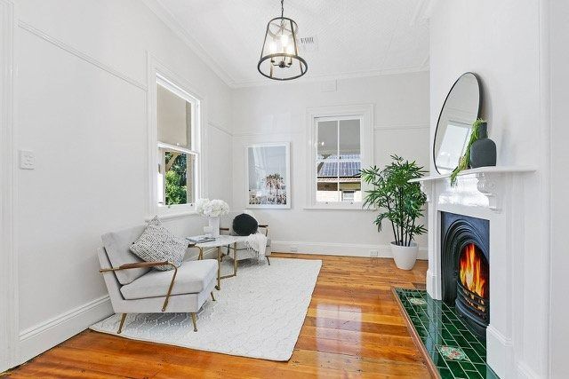 Bright White Living Room with Fireplace — Boyne Building & Renovations in Ponto, NSW