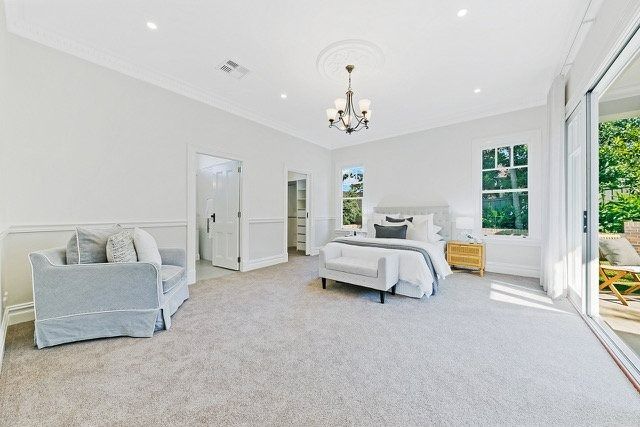 Bright, Empty Bedroom with White Walls — Boyne Building & Renovations in Ponto, NSW