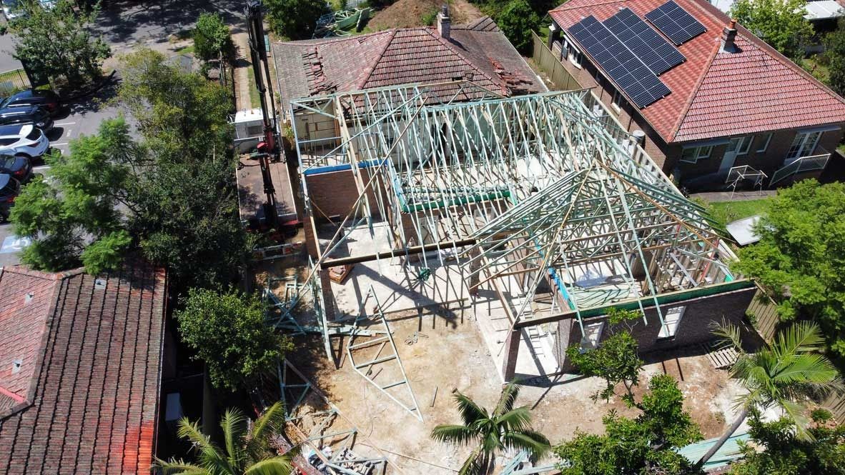 Aerial View of A House Under Construction Beside Homes — Boyne Building & Renovations in Ponto, NSW