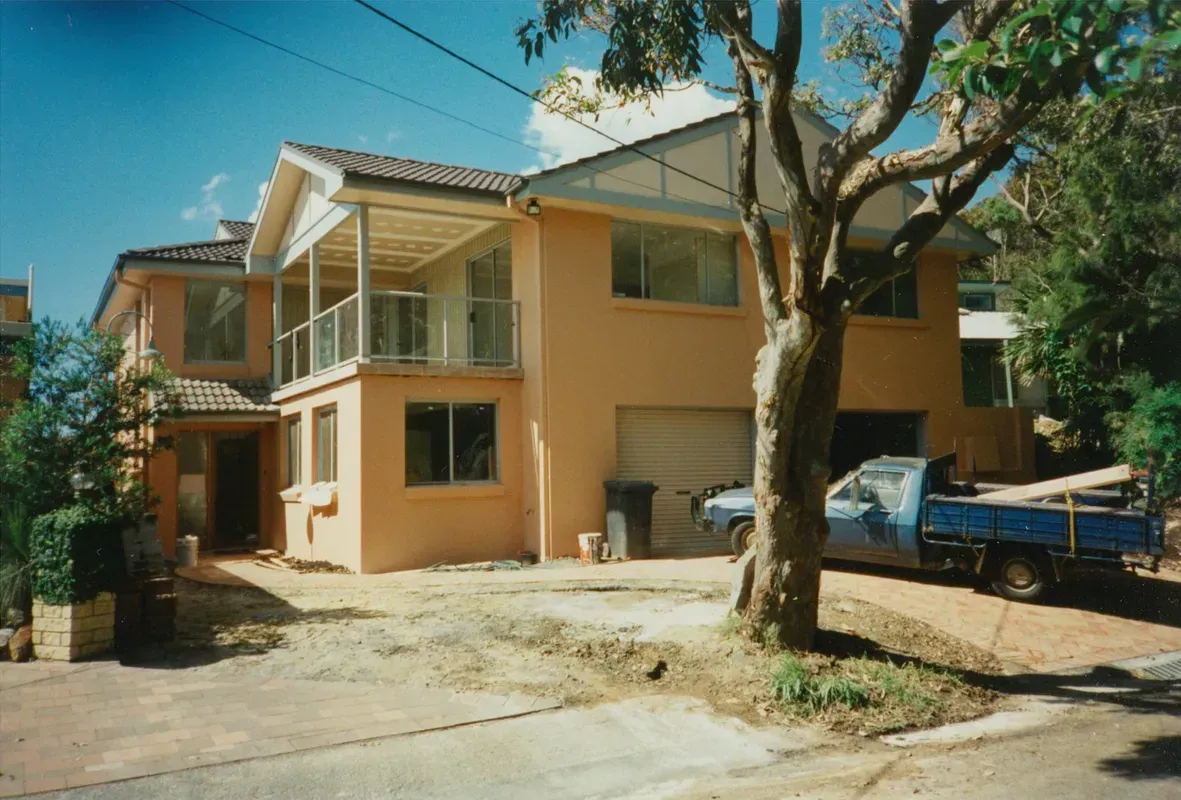Two-Story Tan House with Balcony — Boyne Building & Renovations in Ponto, NSW