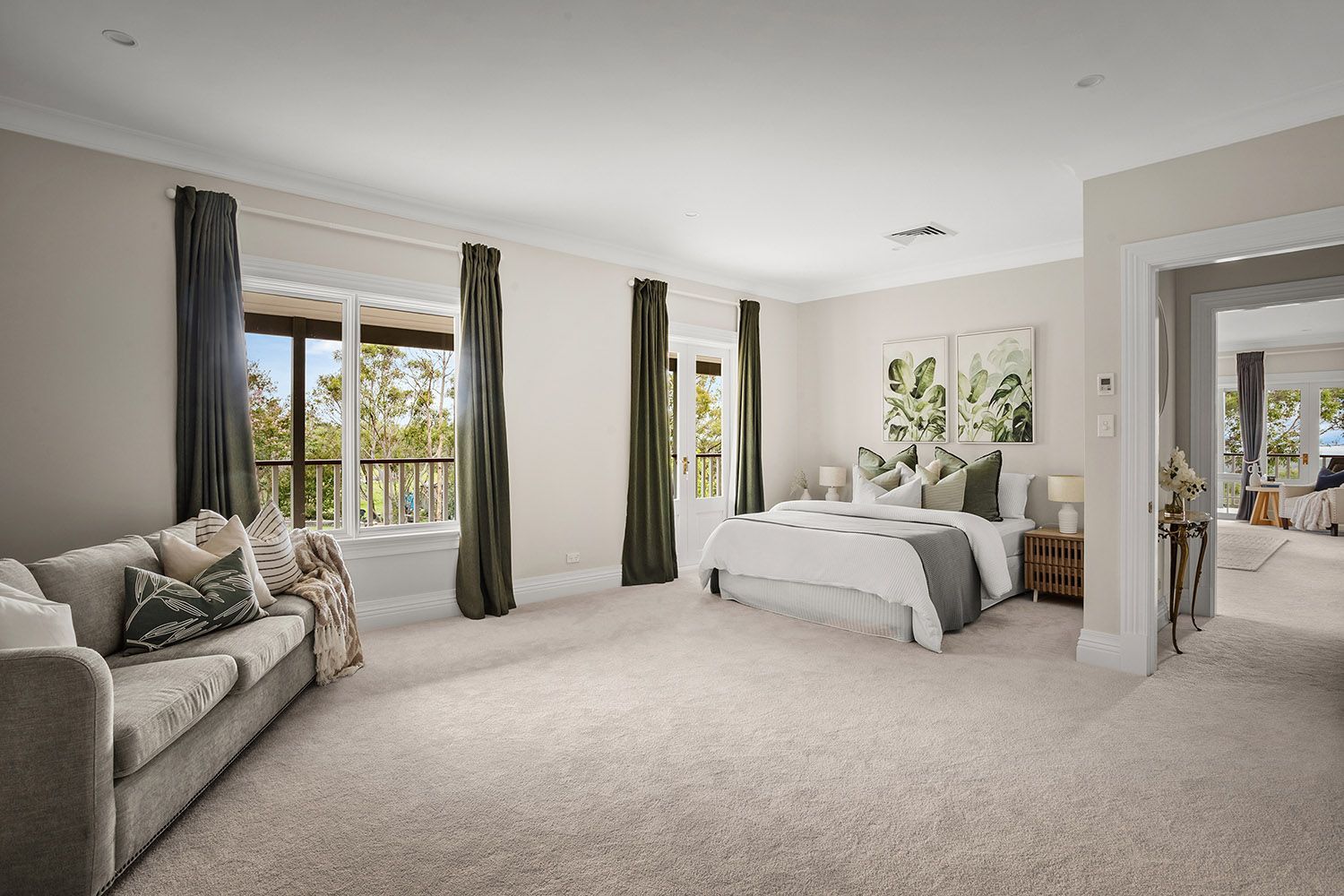 Bright Bedroom With a Bed, Sofa, Large Windows, and Neutral Decor — Boyne Building & Renovations in Ponto, NSW