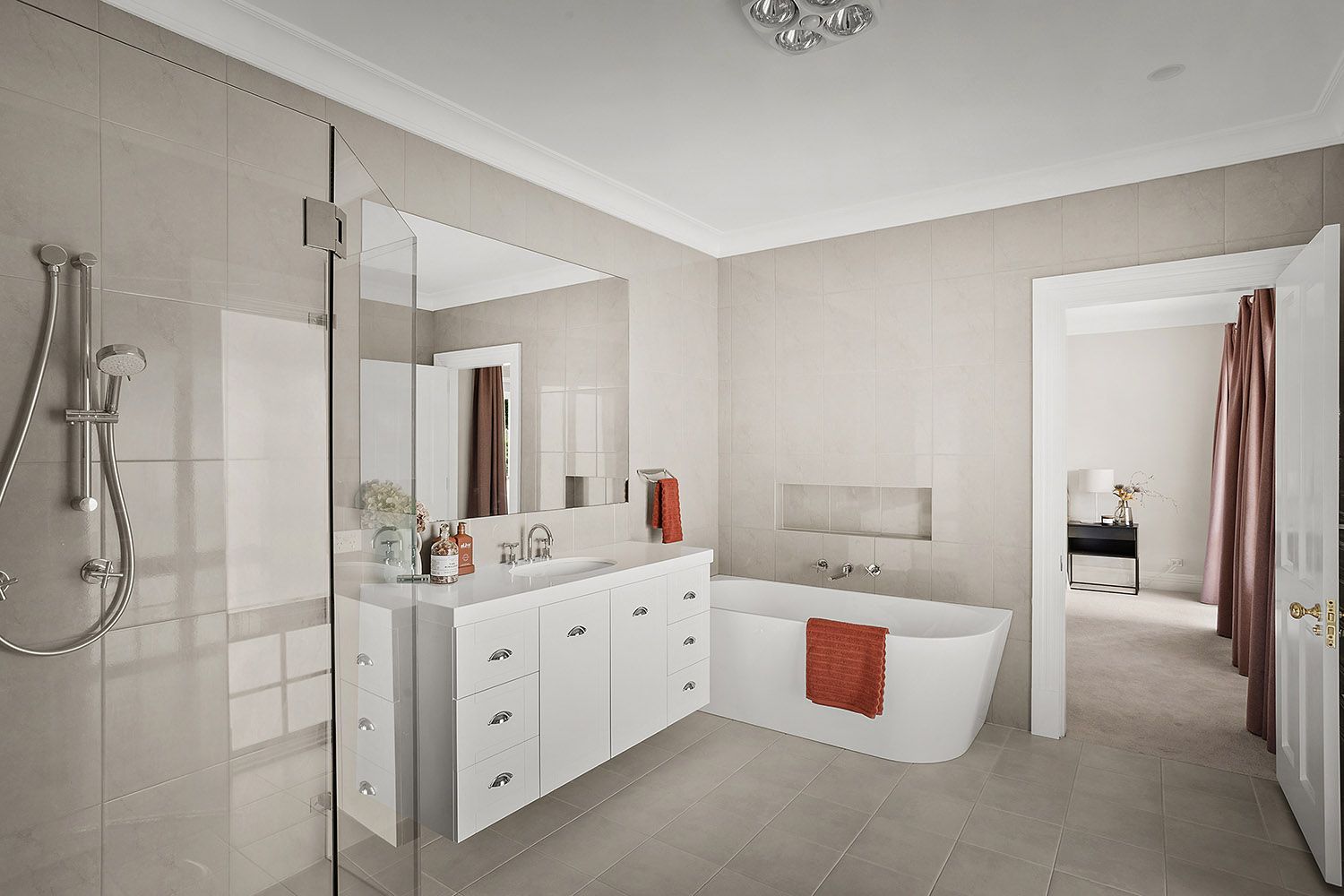 Modern Bathroom With Double Vanity, Large Mirror and Freestanding Tub — Boyne Building & Renovations in Ponto, NSW