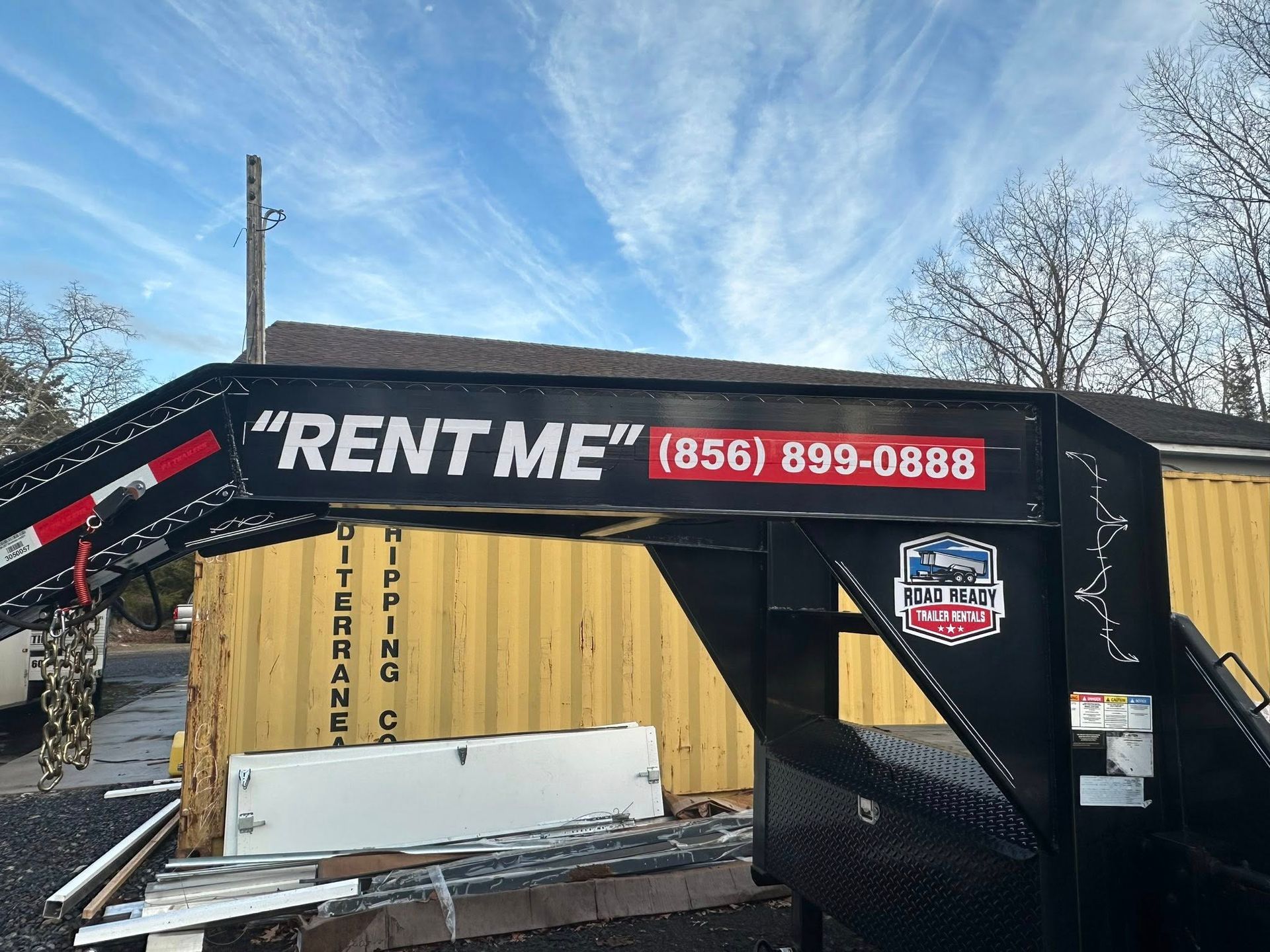 A black gooseneck trailer with 