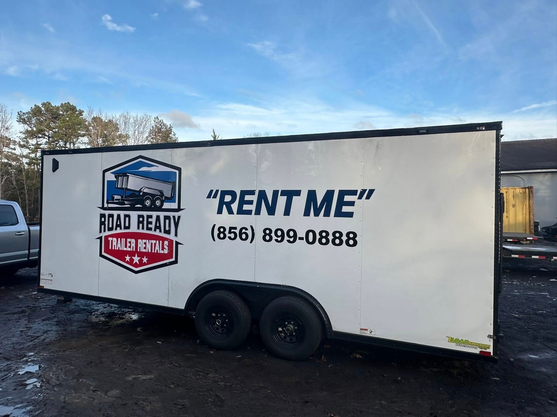 White Road Ready trailer rental with a logo and contact phone number (856) 899-0888 on the side.