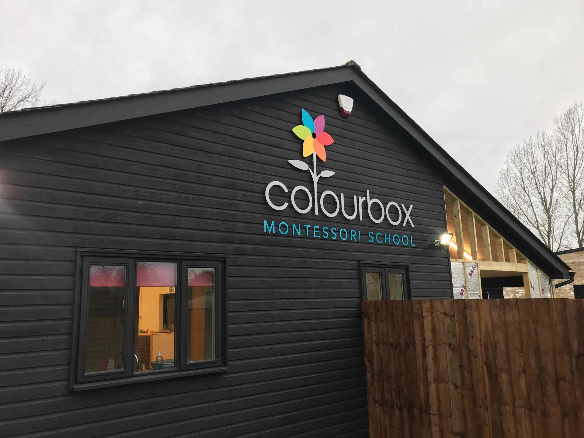 Exterior building signage with fabricated logo and lettering