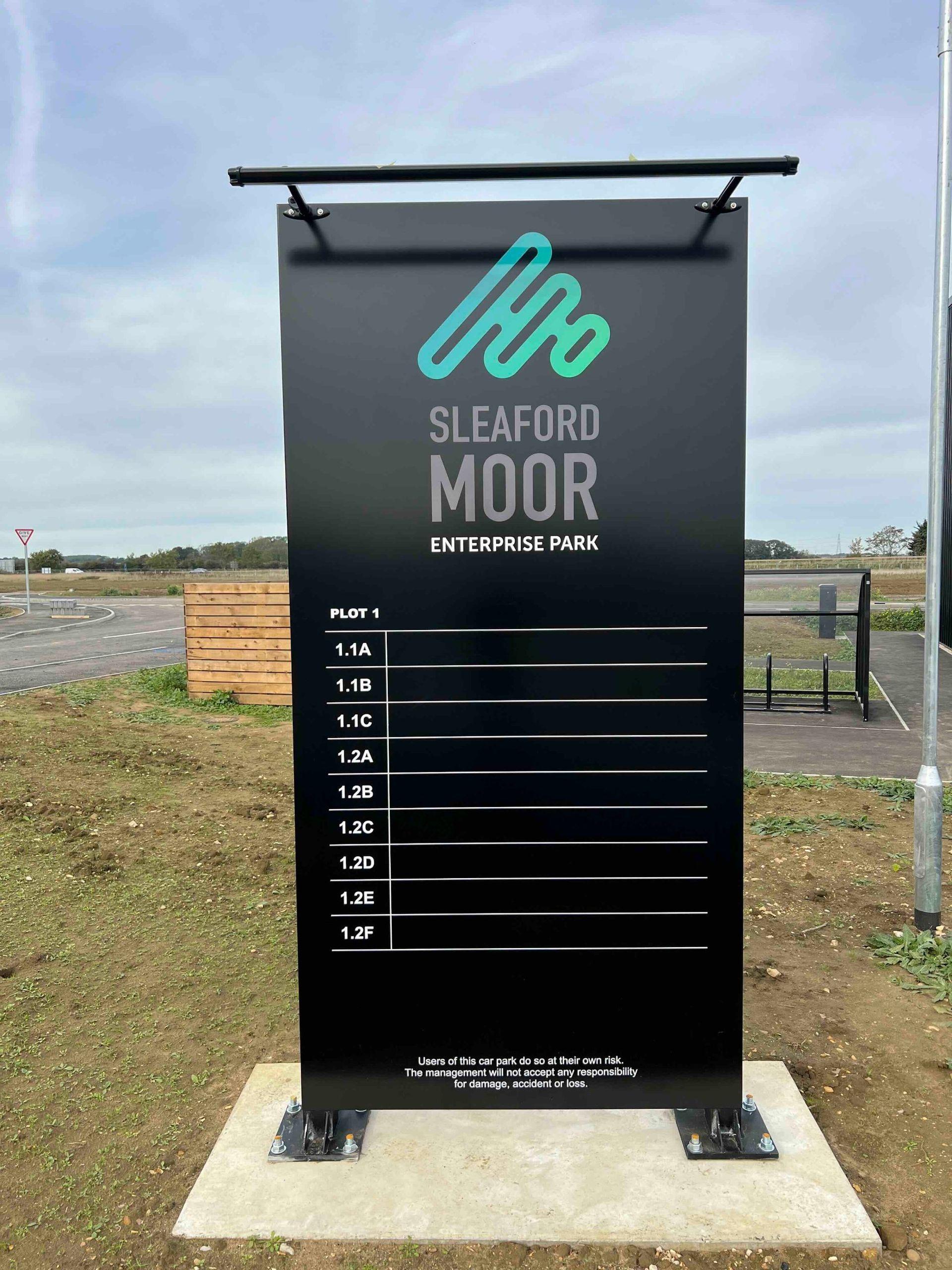 Freestanding monolith directory sign at a business park entrance
