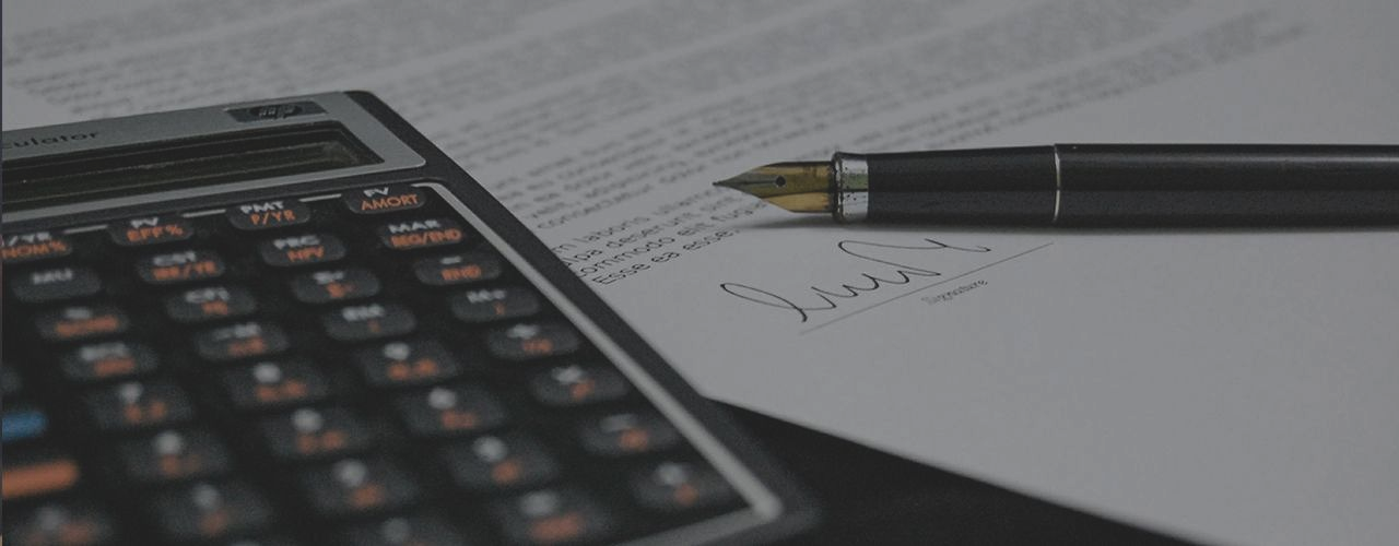Calculator and Pen — Decatur, GA — DeWoskin Law Firm