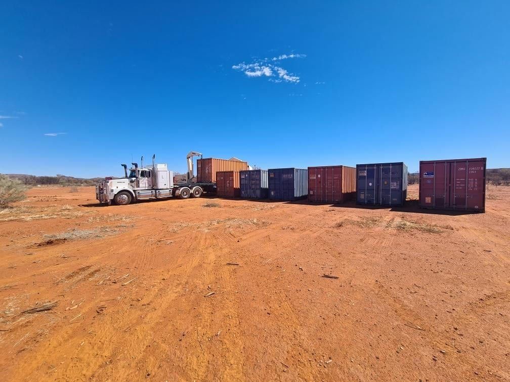 Semi-Truck Pulling Cargo Containers on A Red Dirt Field — Central Australian Sidelifter Haulage in Ciccone, NT